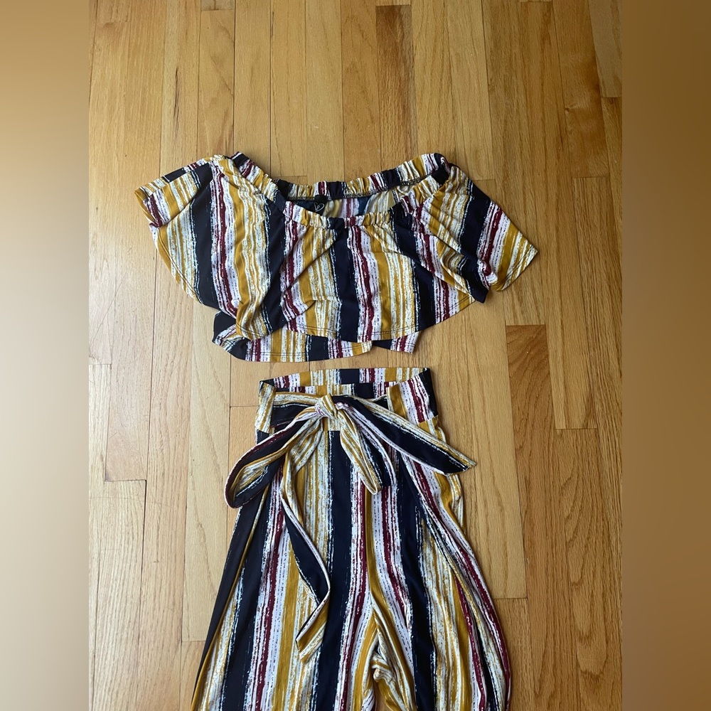 two piece pant set with crop top and flared bottoms